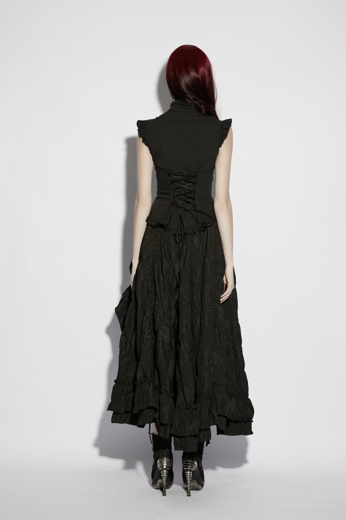Back view of goth ruffle shirt, showcasing intricate details and elegant silhouette. Perfect for a gothic fashion statement.