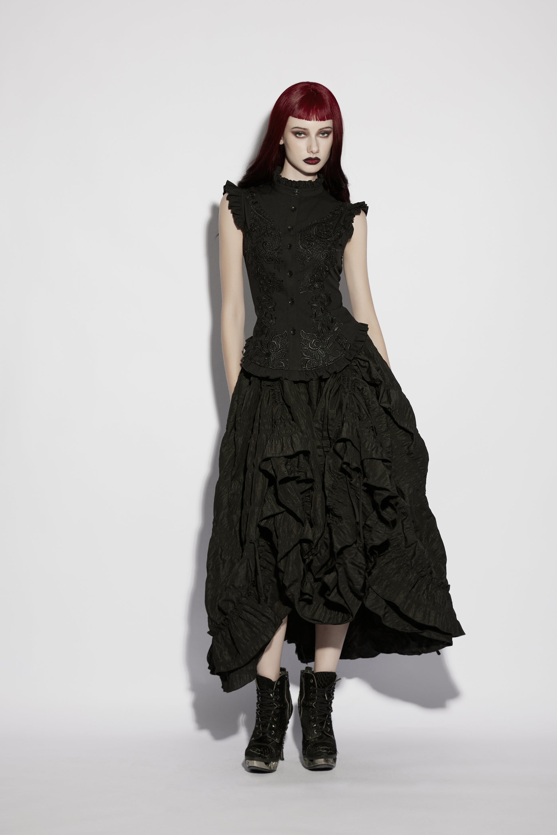 Goth ruffle shirt worn with a flowy black skirt, featuring intricate details and a structured design for gothic elegance.