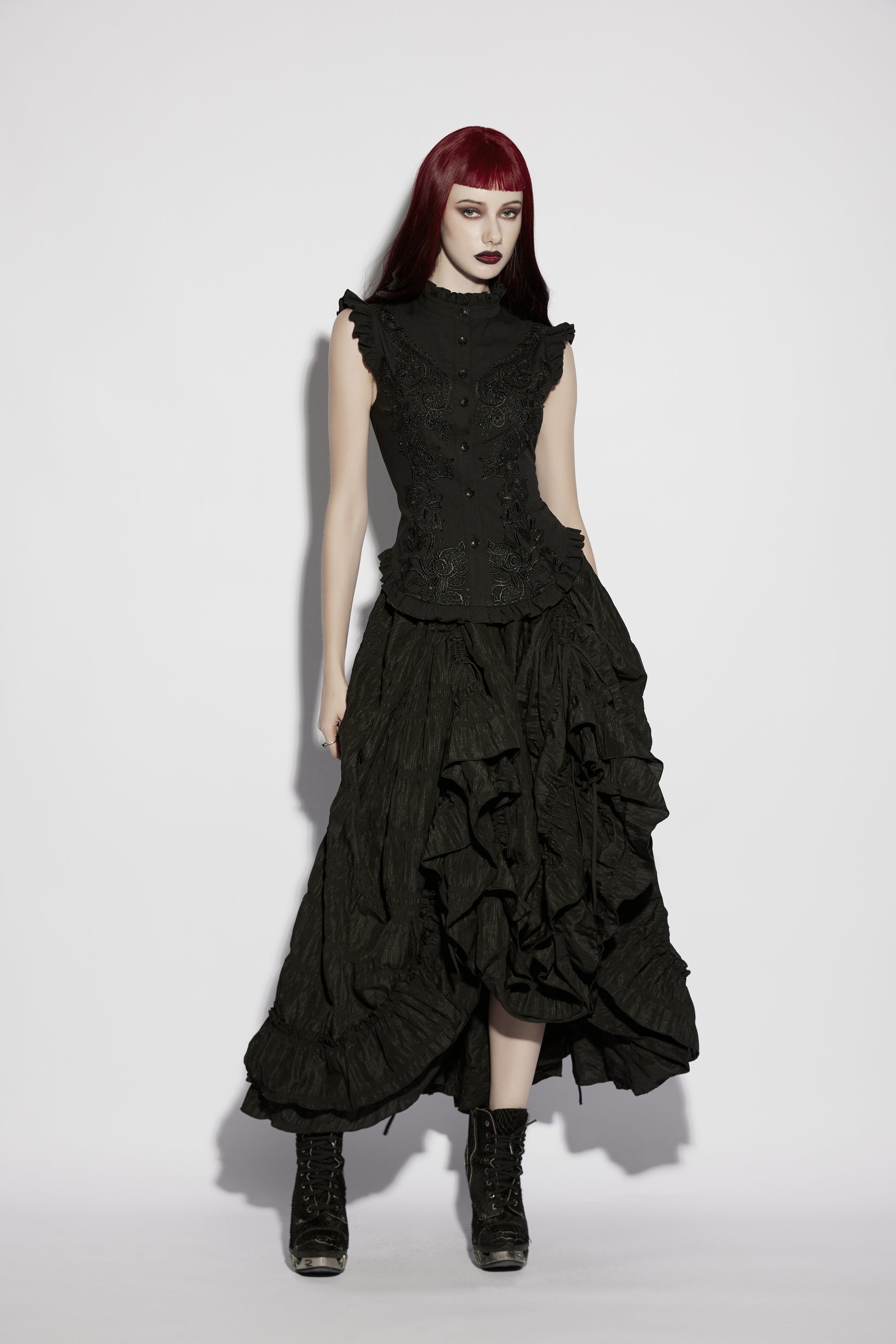 Goth ruffle shirt worn by model with Victorian-inspired design and bold gothic details.