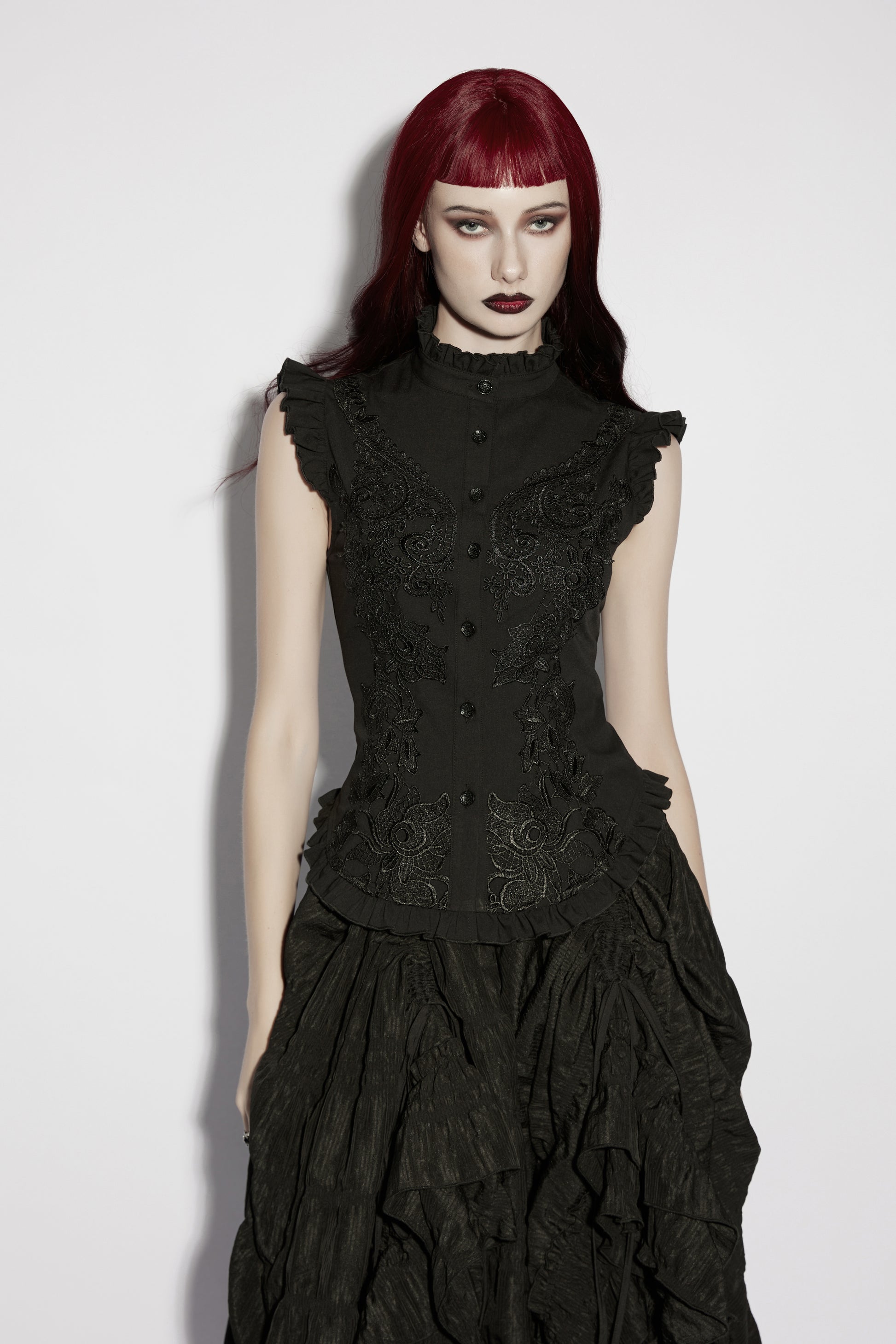 Model wearing a goth ruffle shirt, showcasing Victorian-inspired design and intricate embroidery.
