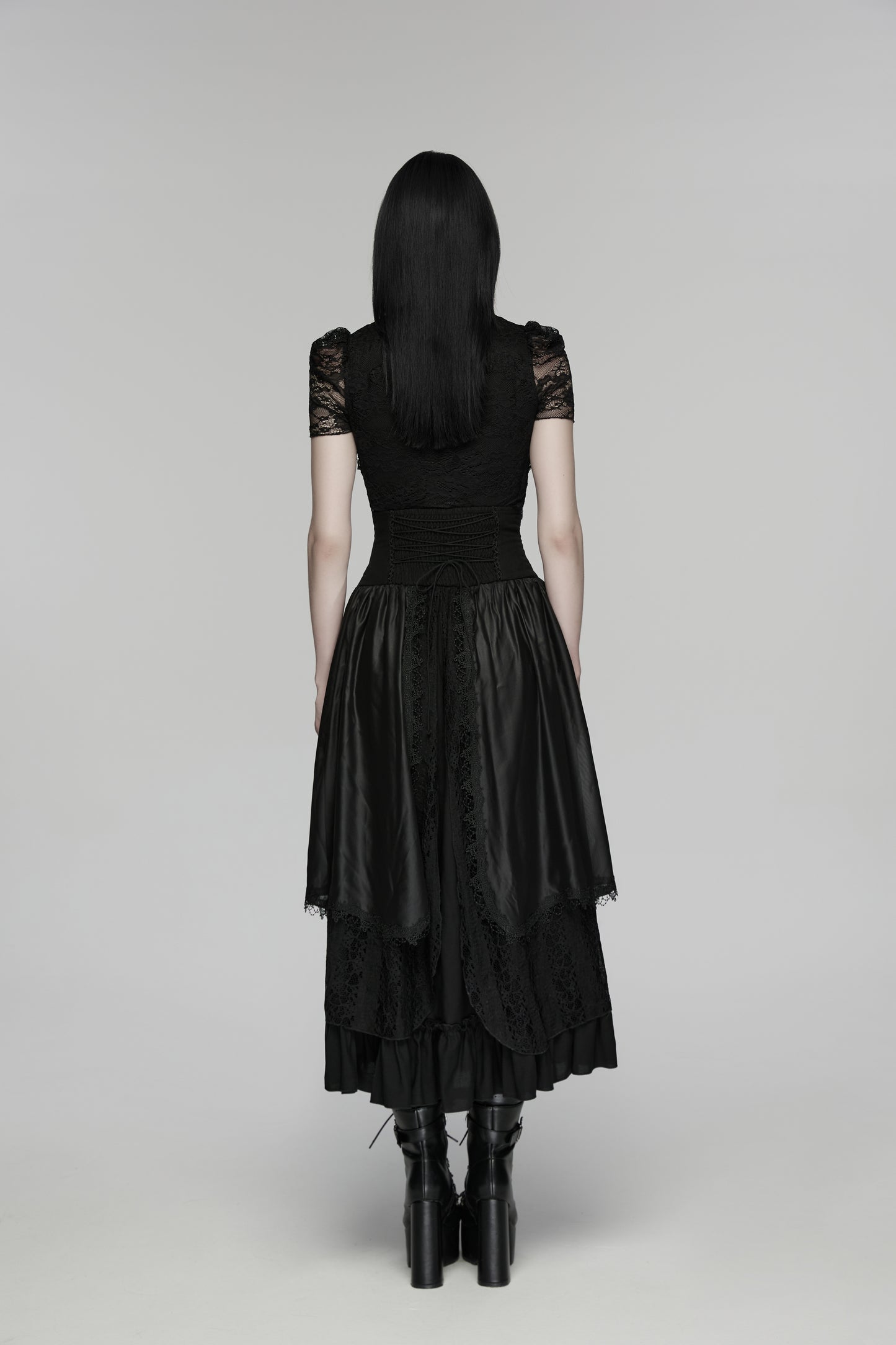 Back view of goth layered skirt showcasing flowing layers and dark texture, highlighting the elegant design.