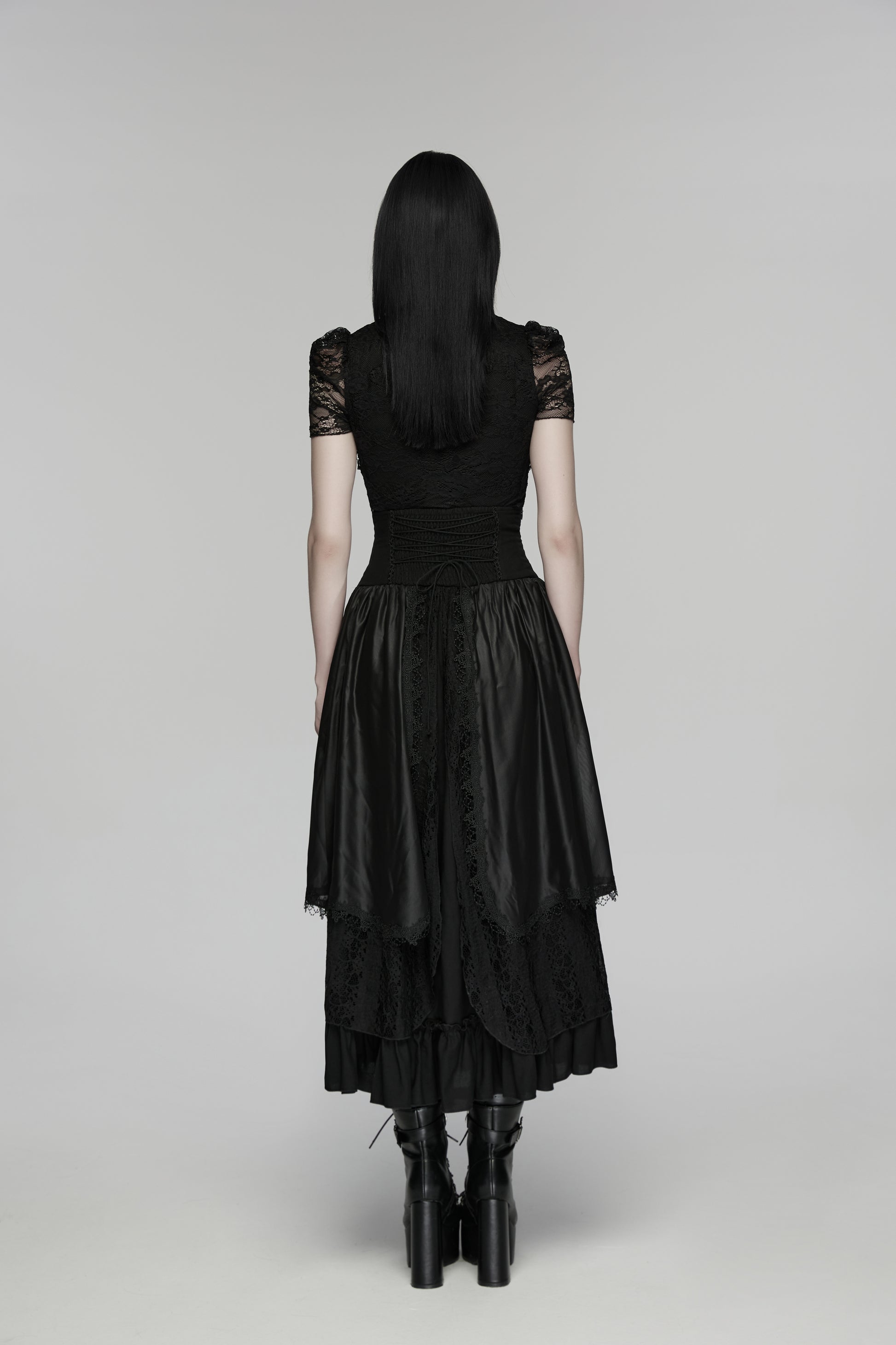 Back view of goth layered skirt showcasing flowing layers and dark texture, highlighting the elegant design.