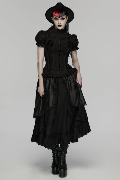 Model wearing a goth layered skirt with a dark romantic texture, complemented by a black hat and boots.