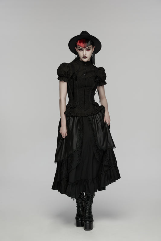Model wearing a goth layered skirt with a dark romantic texture, complemented by a black hat and boots.