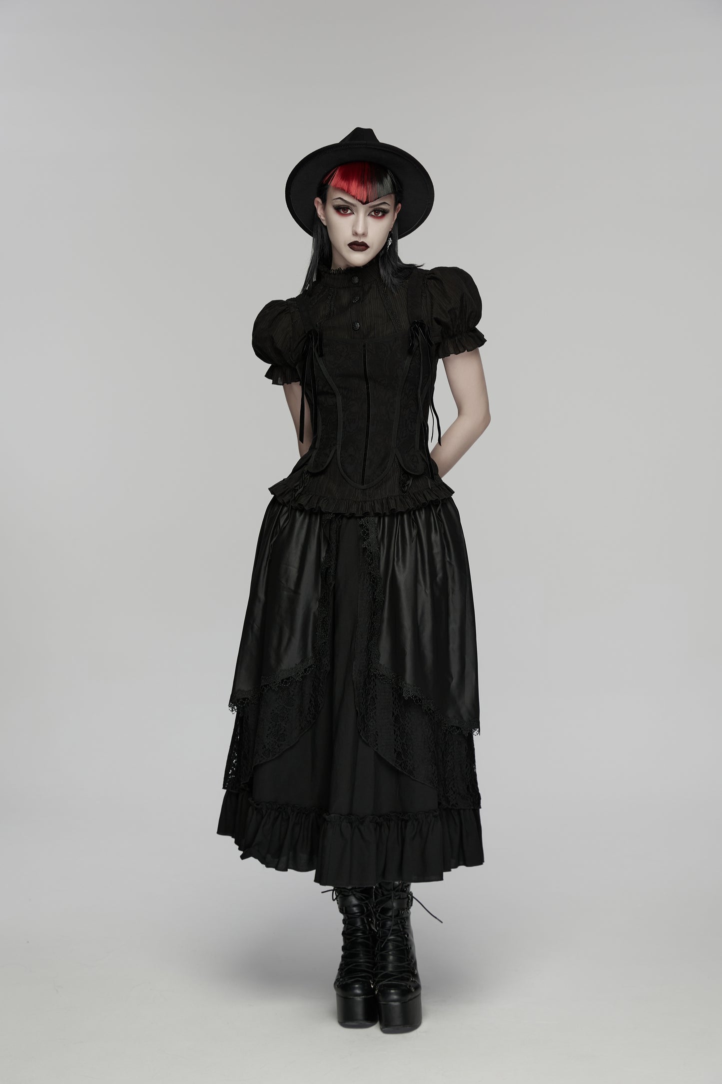 Goth layered skirt worn by model with dramatic makeup and hat, showcasing Punk Rave Morrigan Forest Skirt.