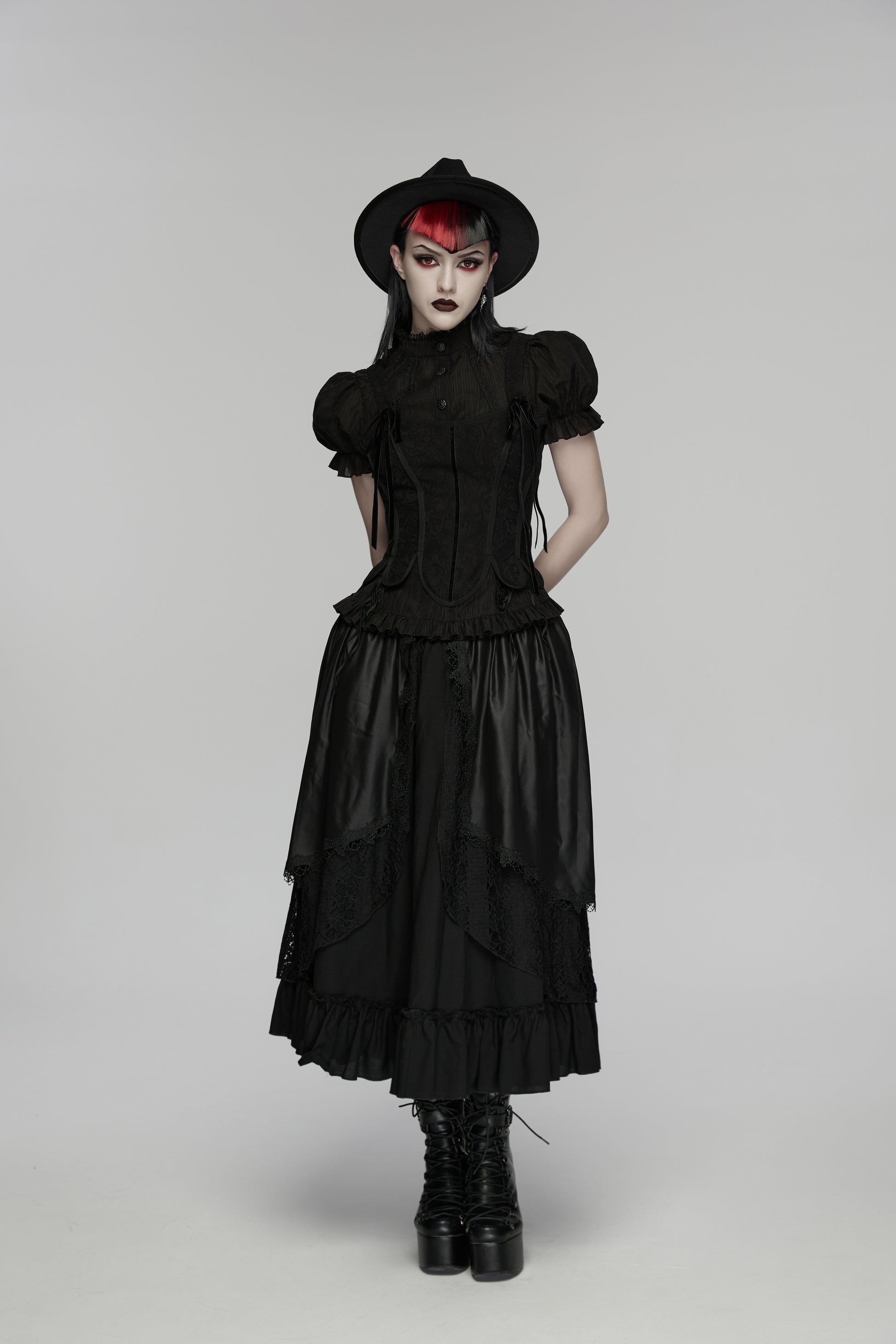 Goth layered skirt worn by model with dramatic makeup and hat, showcasing Punk Rave Morrigan Forest Skirt.