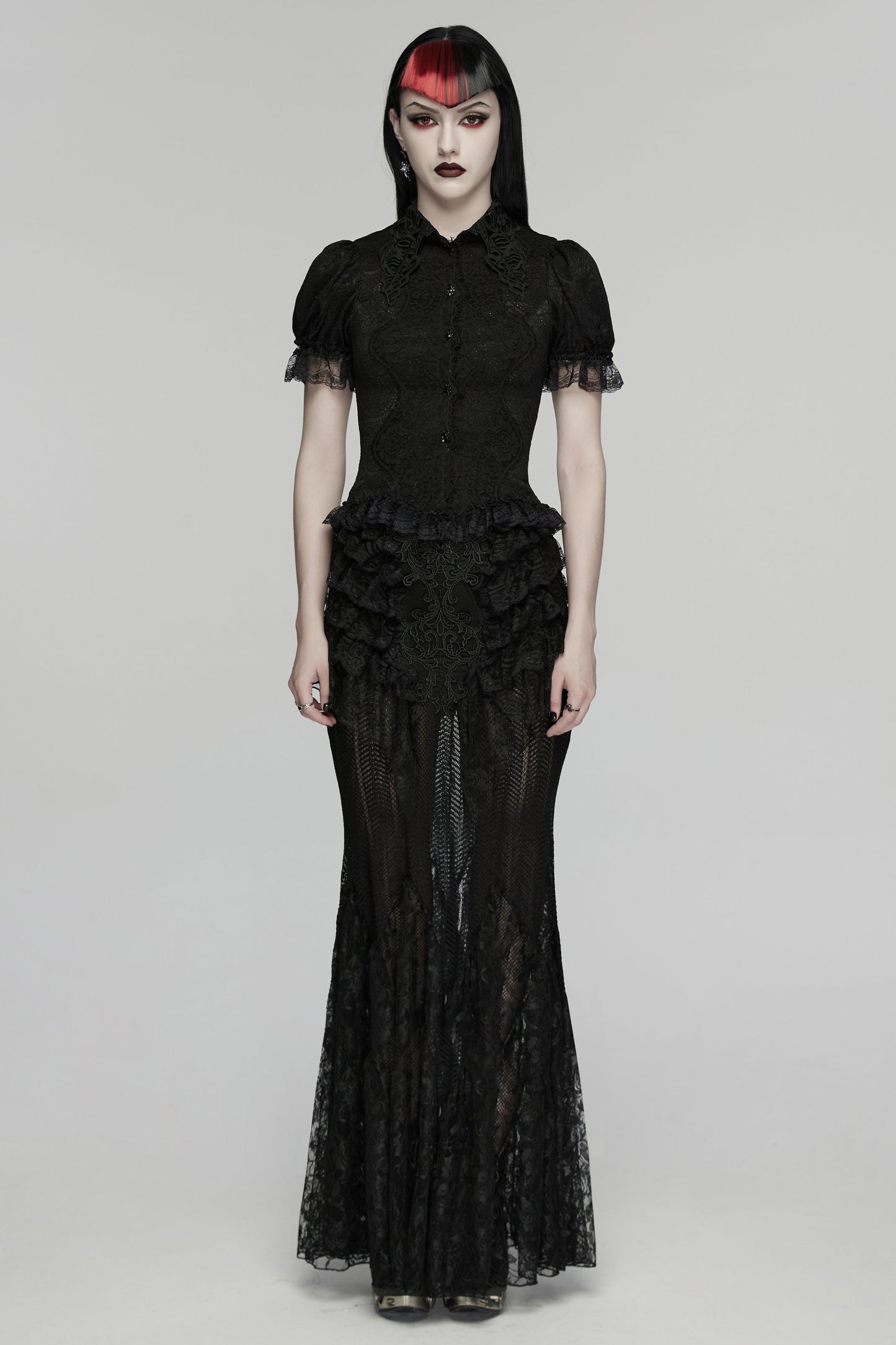 Model wearing a lace goth shirt, featuring short sleeves and intricate lace detailing, showcasing gothic elegance.