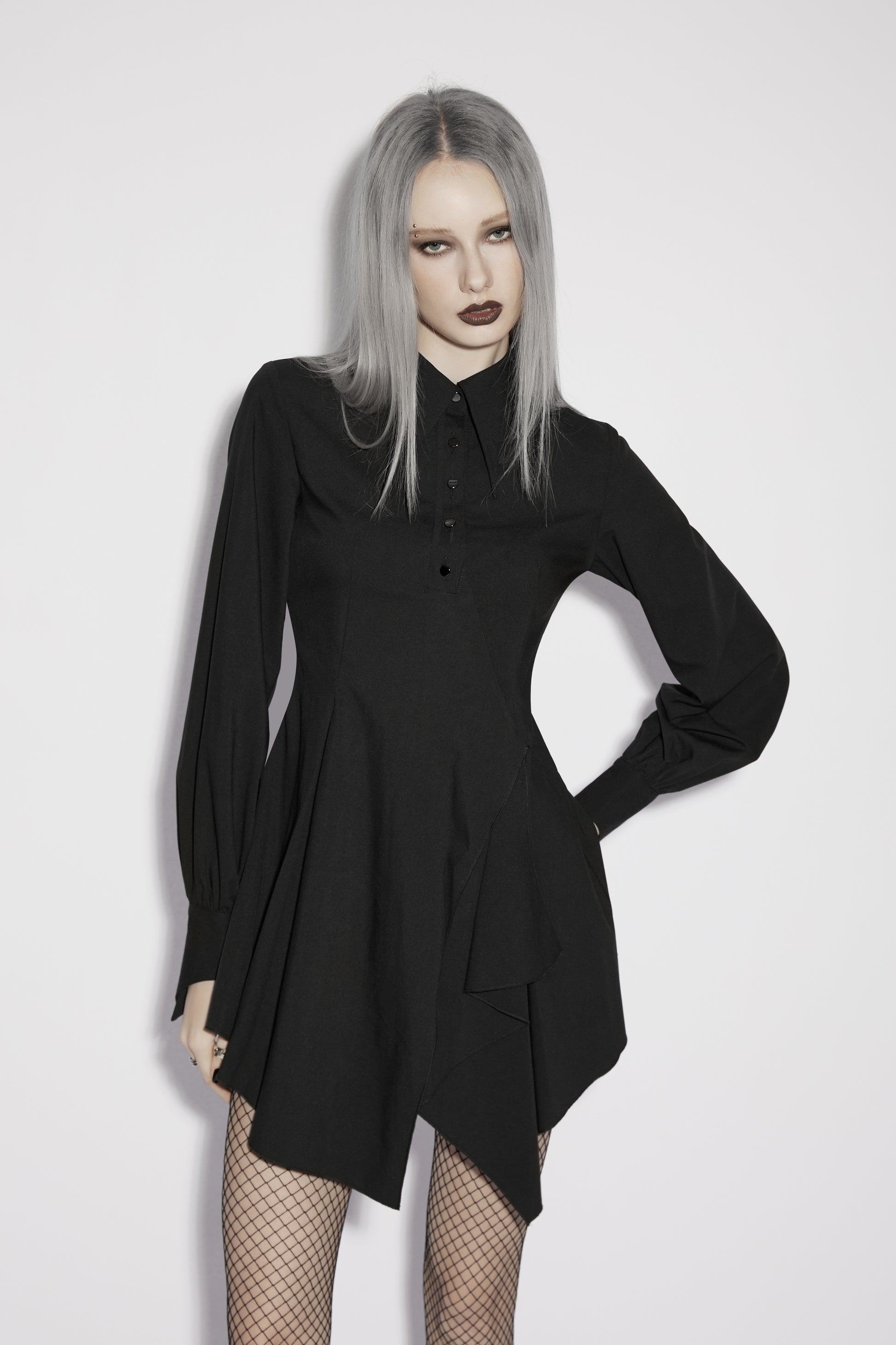 Model wearing the Punk Rave Nyx Asymmetrical Shirt Dress featuring a dark elegant design and edgy style.