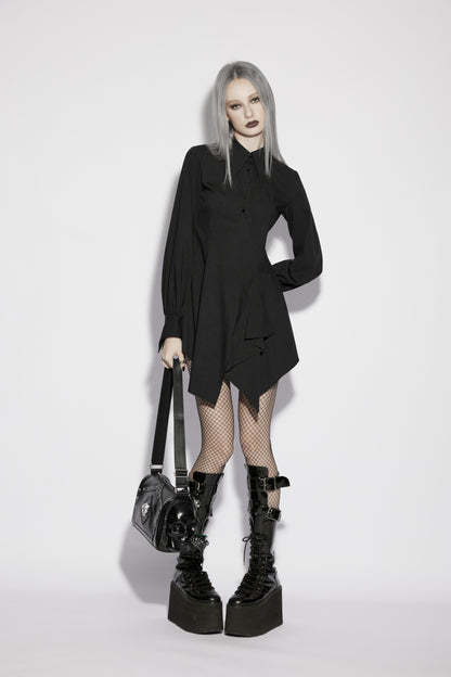 Punk Rave Nyx Asymmetrical Shirt Dress worn by a model with edgy style, paired with platform boots and fishnet stockings.