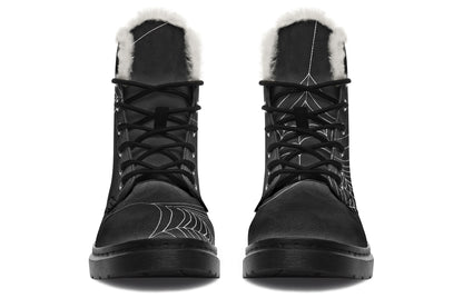 Black winter boots with fur lining on a white background