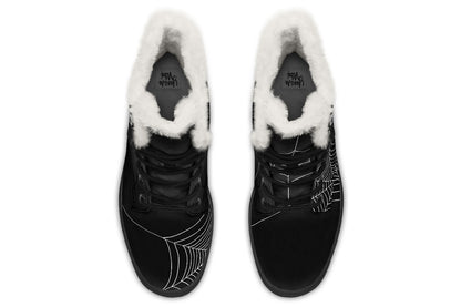Black winter boots with white fur lining on a white background