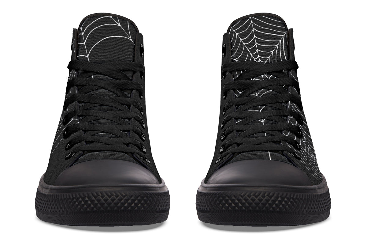 Black high-top sneakers with spider web design on a white background