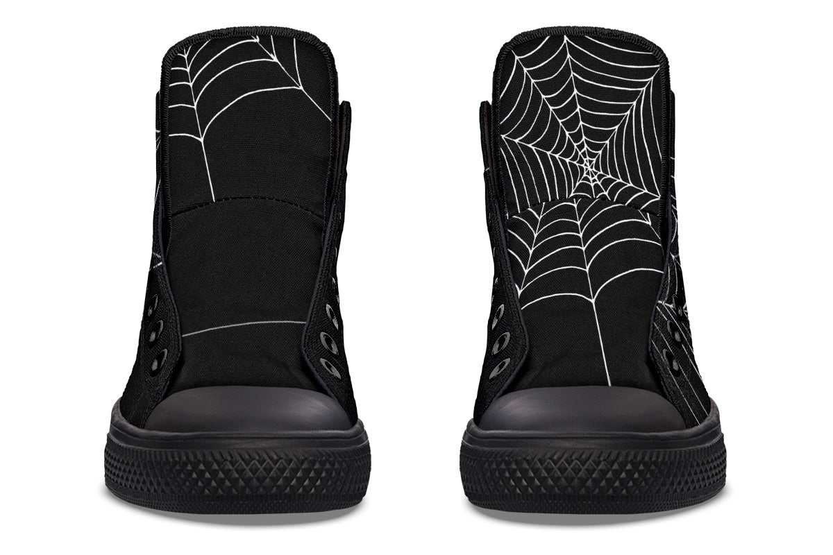 Black high-top sneakers with spider web design on a white background