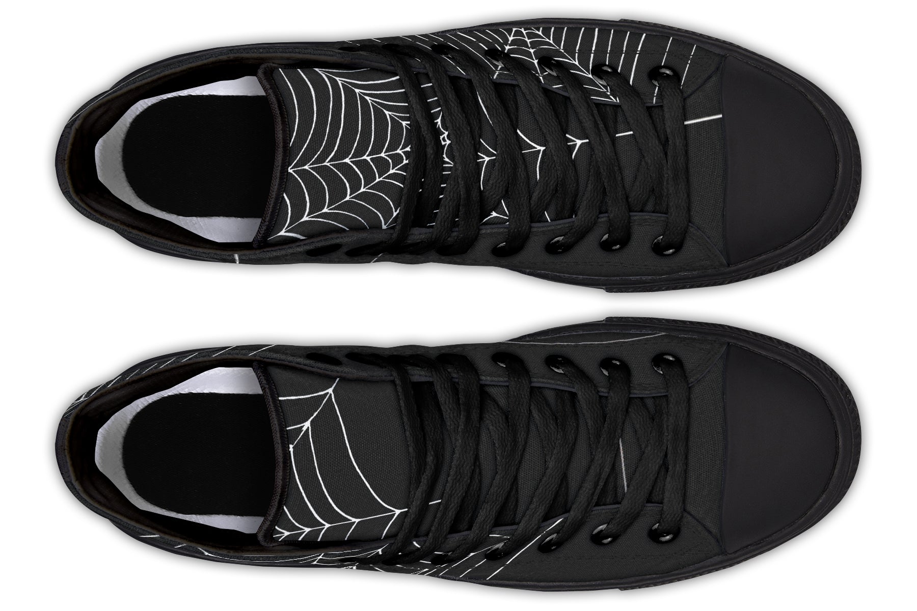 Black trainers with spider web design on a white background