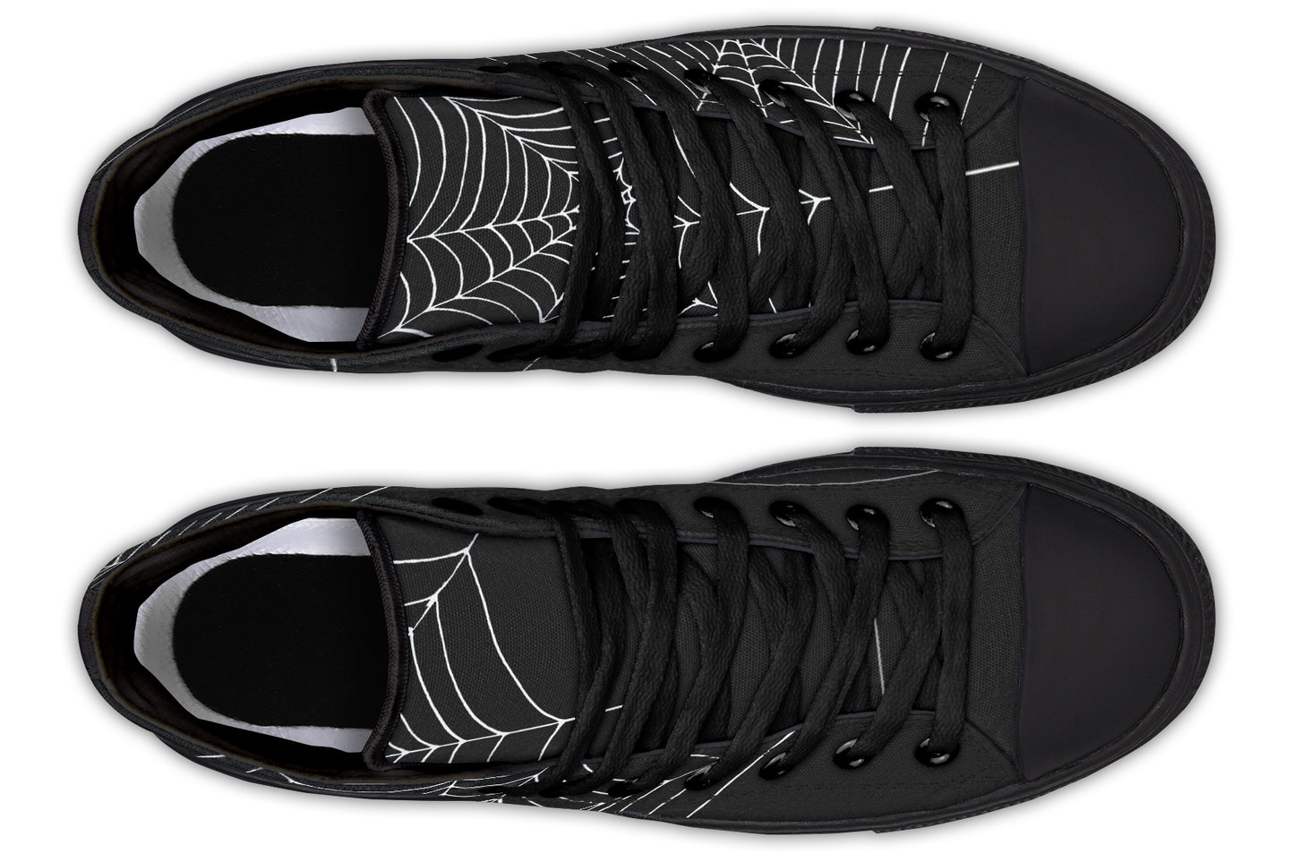 Black trainers with spider web design on a white background