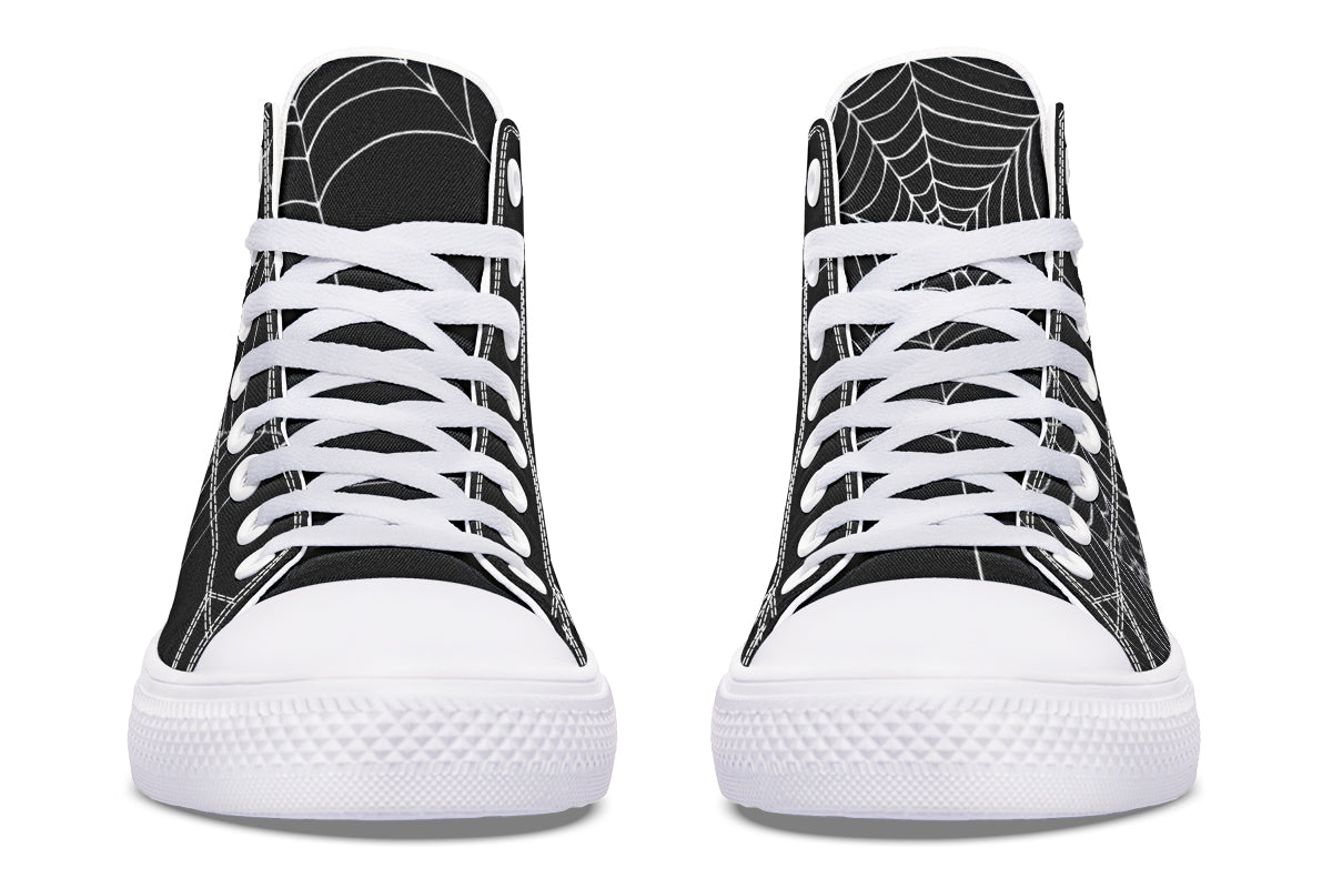 Black high-top sneakers with white spider web design on a white background