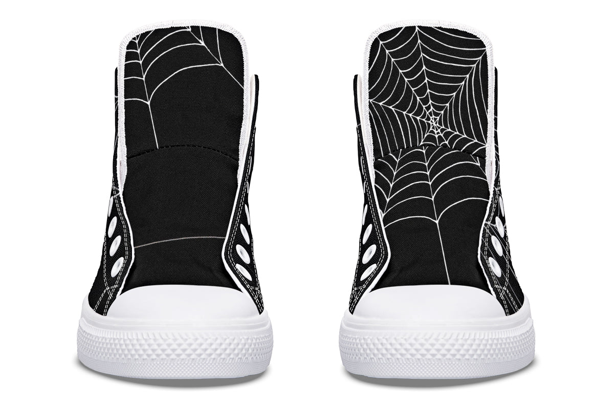 Black high-top sneakers with spider web design on a white background