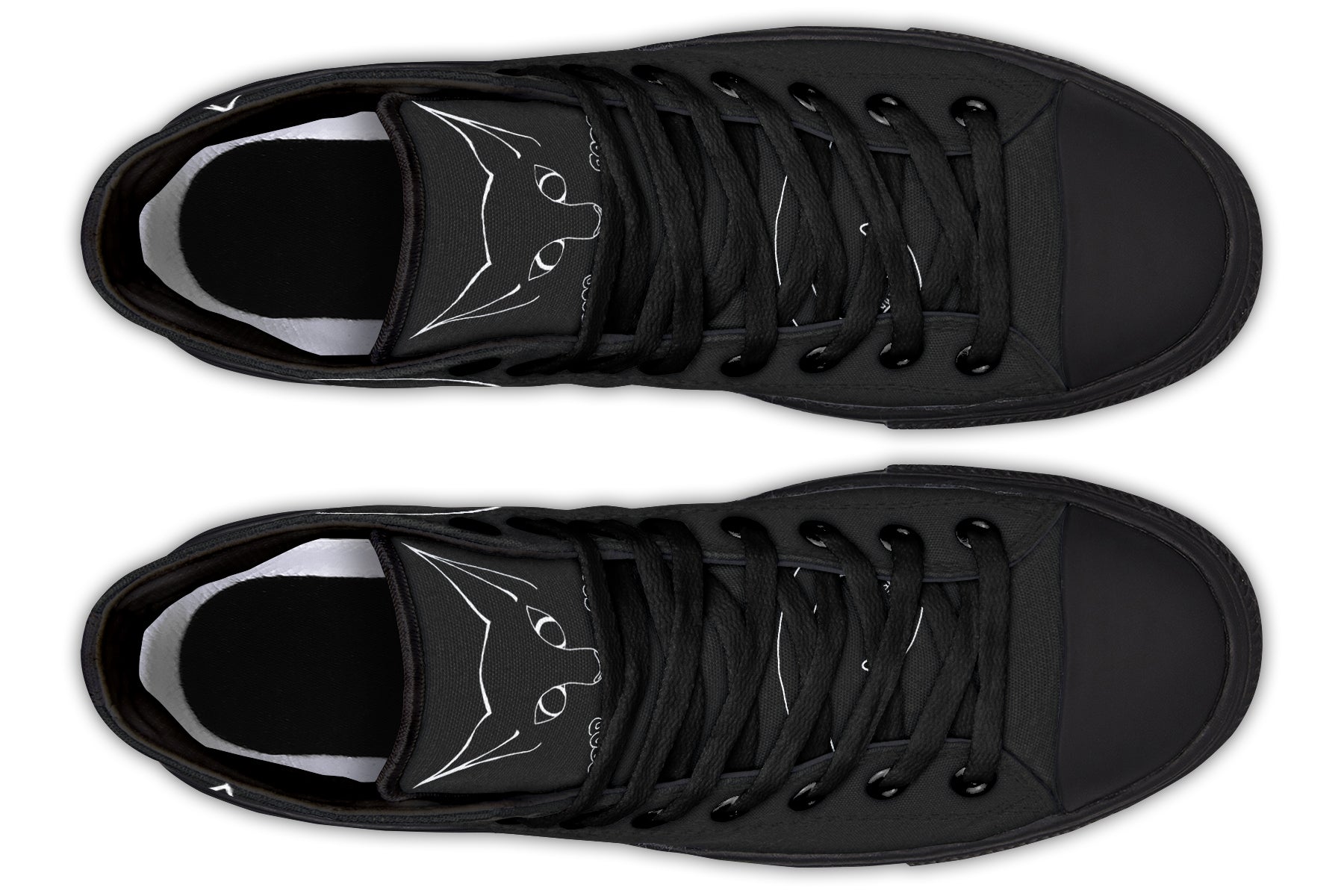 Pair of black sneakers with white cat designs on a white background