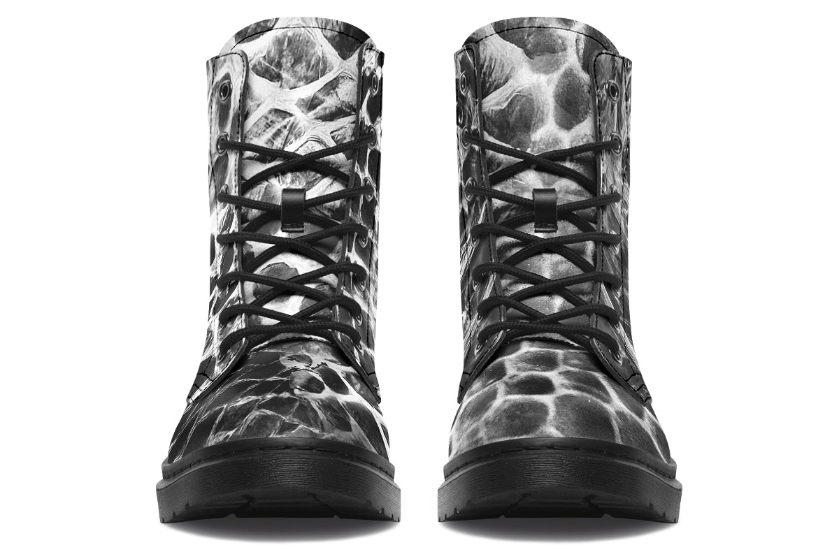 Pair of black and gray patterned boots on a white background