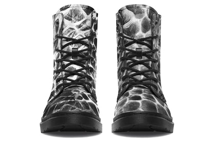 Pair of black and gray patterned boots on a white background
