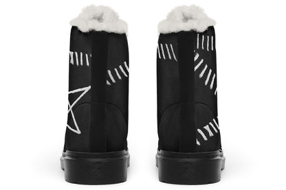 Black boots with white patterns and fur lining on a white background
