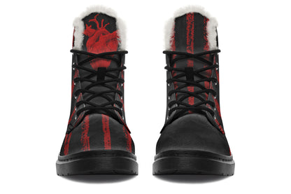Black and red boots with a heart design on a white background