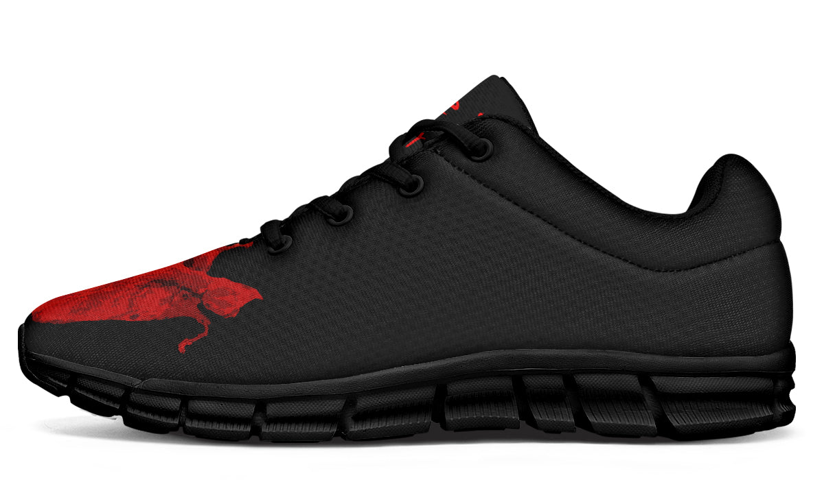Black and red athletic shoe on a white background