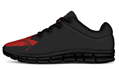 Black and red athletic shoe on a white background