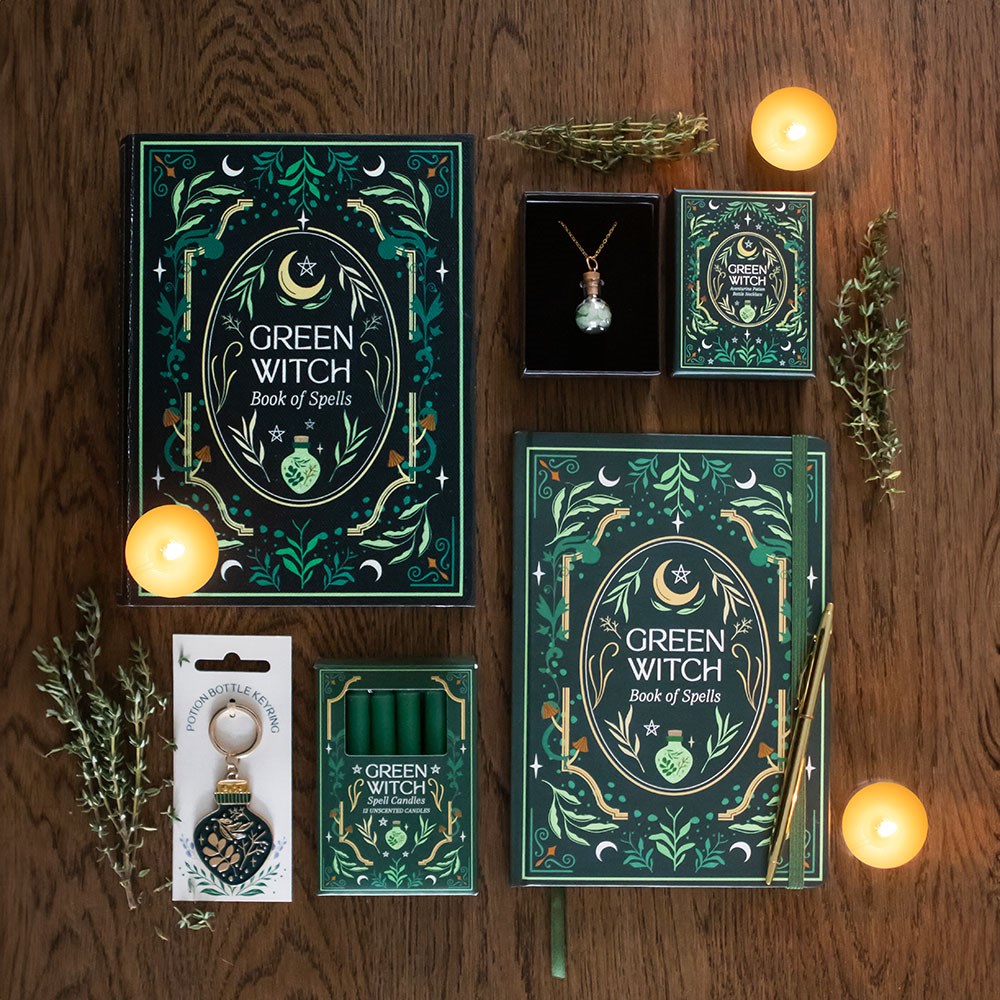 Witch Storage Box featuring Green Witch Book of Spells, candles, and mystical accessories on a wooden table.