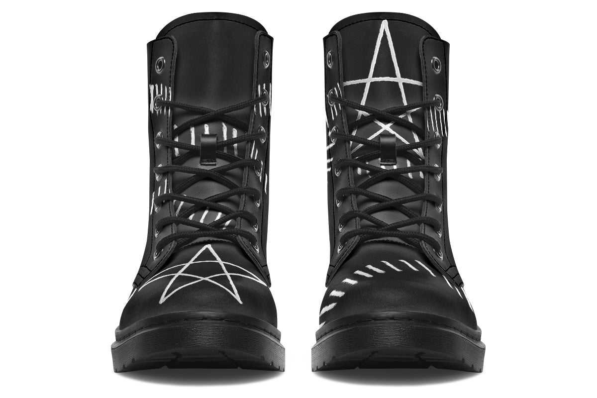 Black high-top boots with star designs on a white background