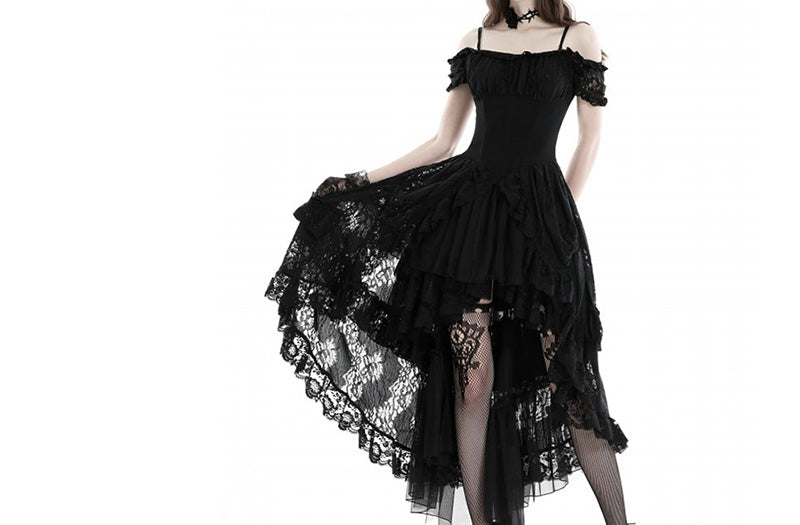 A black off-the-shoulder gothic dress with a layered ruffled skirt, sheer lace trim, and a high-low hemline, shown on a model against a white background.