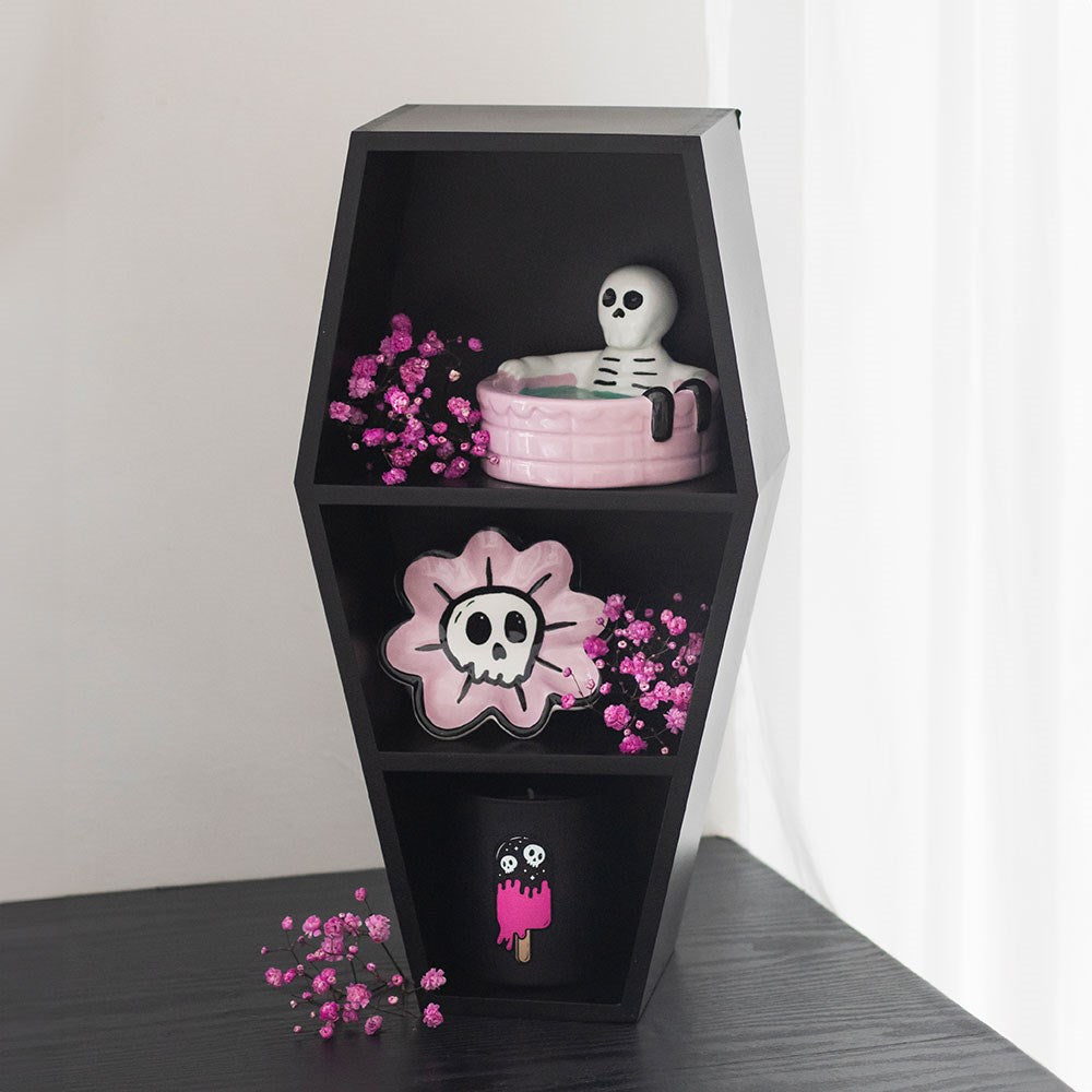 Small Black Coffin Display Shelf showcasing decorative items and flowers for gothic-inspired decor.