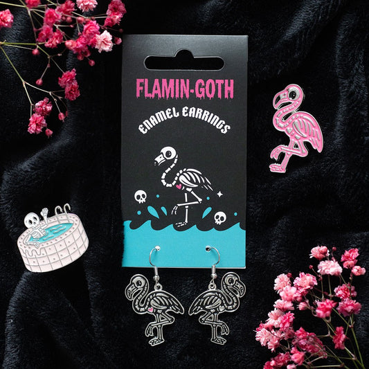 Flamingo skeleton earrings with packaging on a dark background with pink flowers.