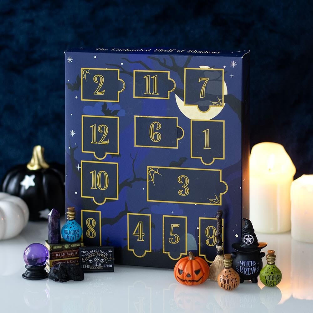 Halloween-themed advent calendar with decorative items on a dark background