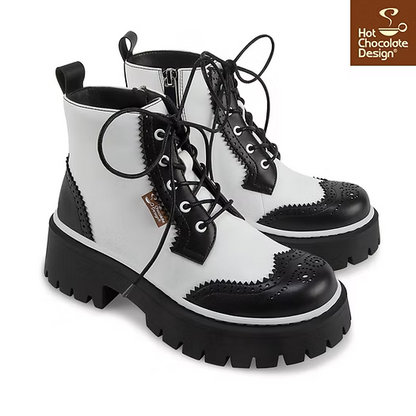 Black and white platform boots with 'Hot Chocolate Design' logo.