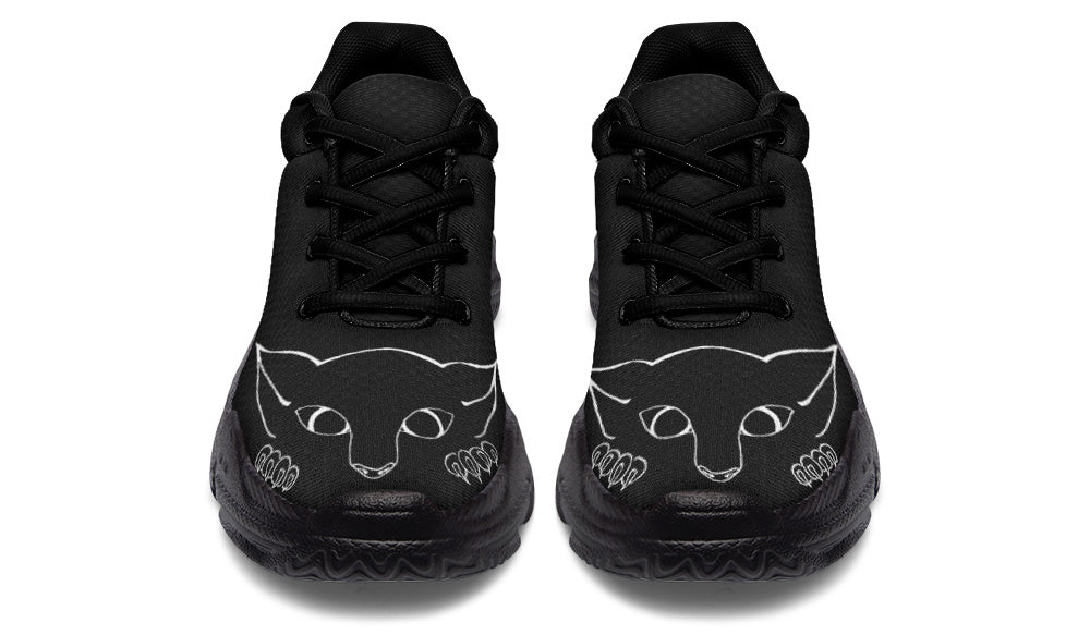 Black high-top sneakers with cat face designs on a white background