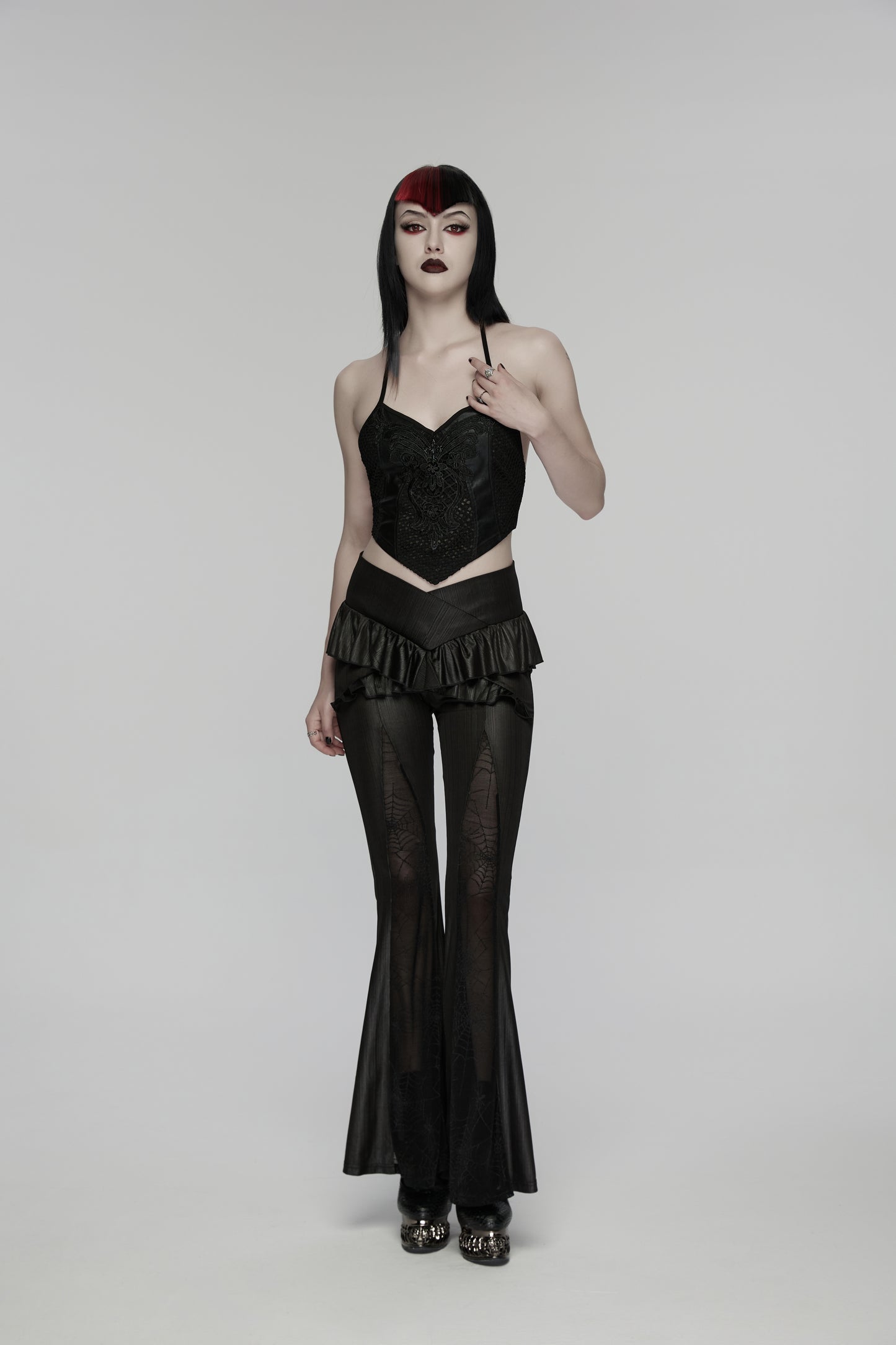 Model wearing Punk Rave Bellatrix Goth Leggings Flares with Spiderweb Panel