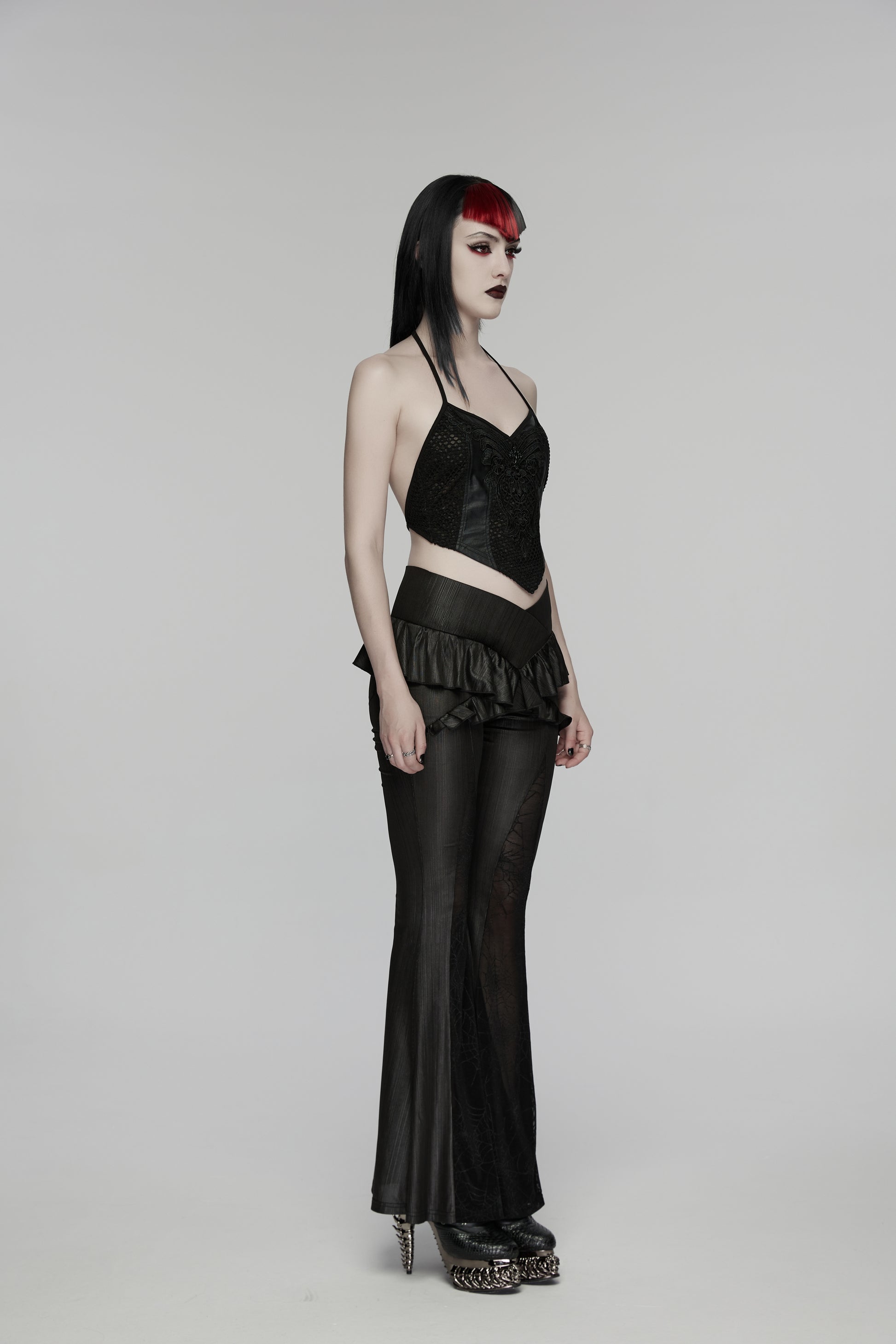 Model wearing Punk Rave Bellatrix Goth Leggings Flares - Spiderweb Panel Alt Flared Trousers side view