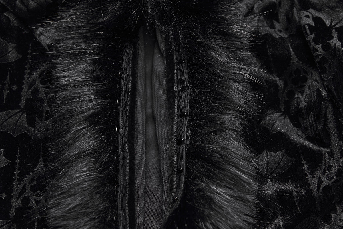 Close up of hook and eye closure on a black velvet gothic jacket with faux fur trim