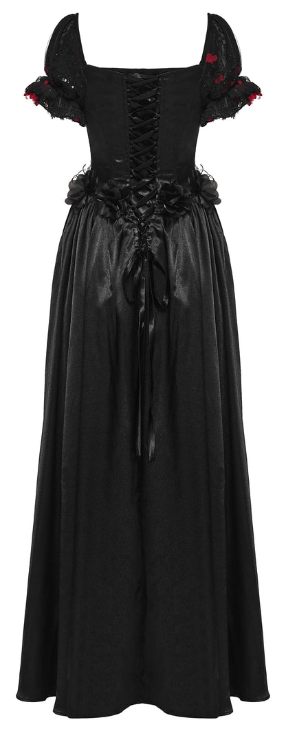 A black gothic-style maxi dress with a lace-up corset bodice, ruffled short sleeves with red floral accents, and a long flowing skirt.