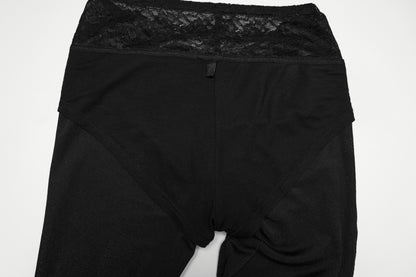 Punk Rave Lilith Low Waist Flared Pants showcasing a black lace waist and sleek material.