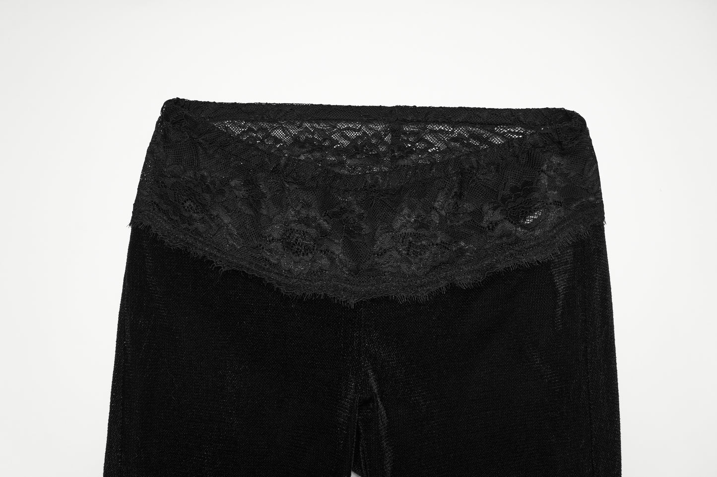 Punk Rave Lilith Low Waist Flared Pants showcasing a lace waistband detail against a black background.