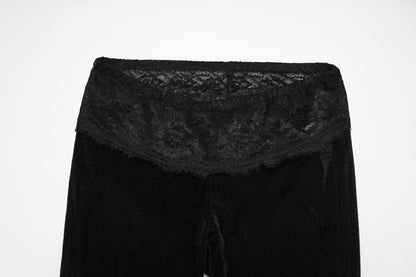 Punk Rave Lilith Low Waist Flared Pants showcasing a lace waistband detail against a black background.