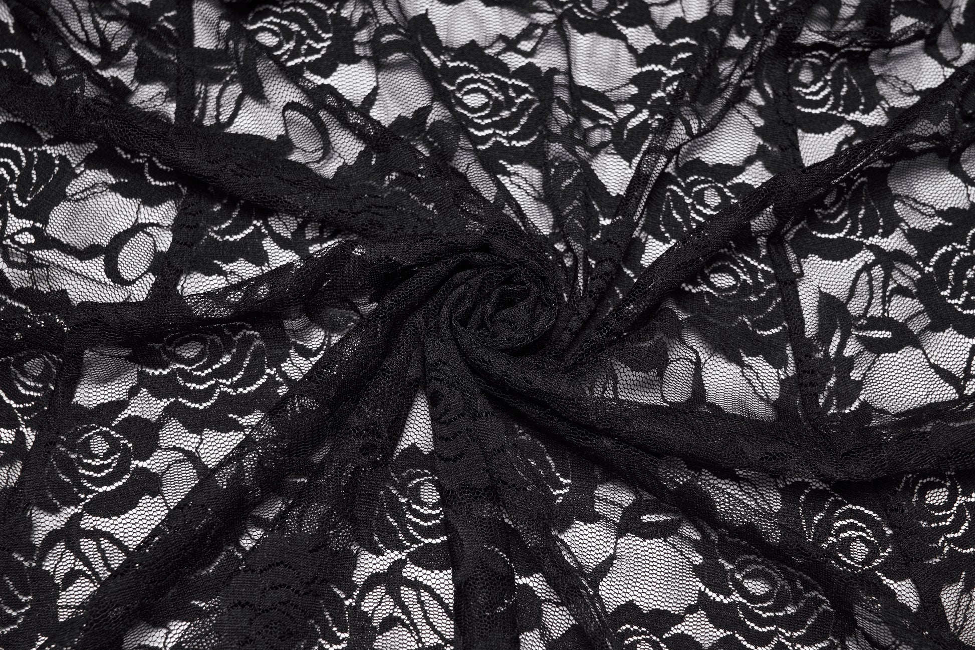 Close-up of black lace fabric with floral patterns