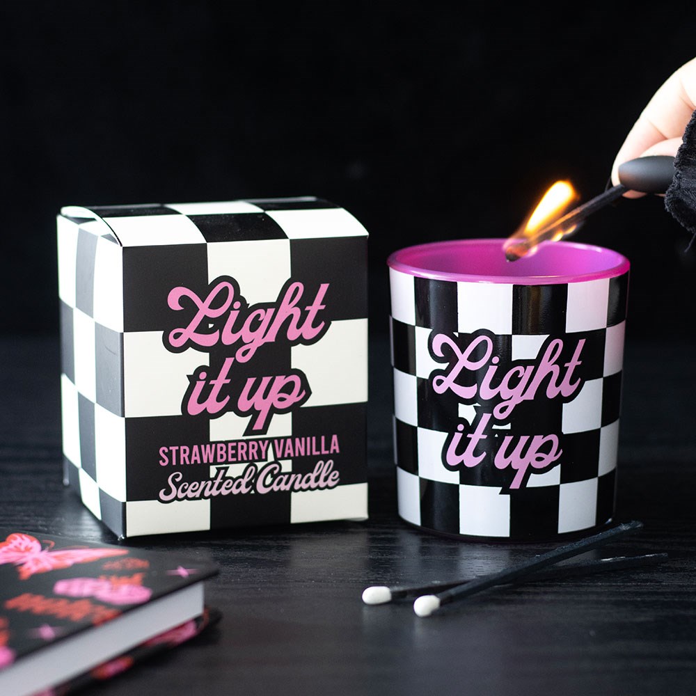 Strawberry vanilla candle in black and white checkerboard design with pink typography, perfect for alternative home decor.