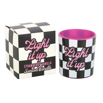 Strawberry vanilla candle in black and white checkerboard packaging with pink typography, ideal for alternative home decor.