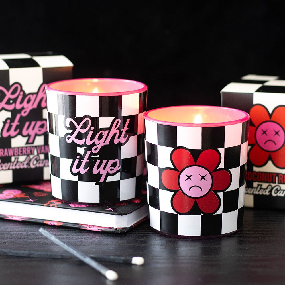 Strawberry vanilla candle with checkerboard design and pink typography, perfect for alternative home décor.