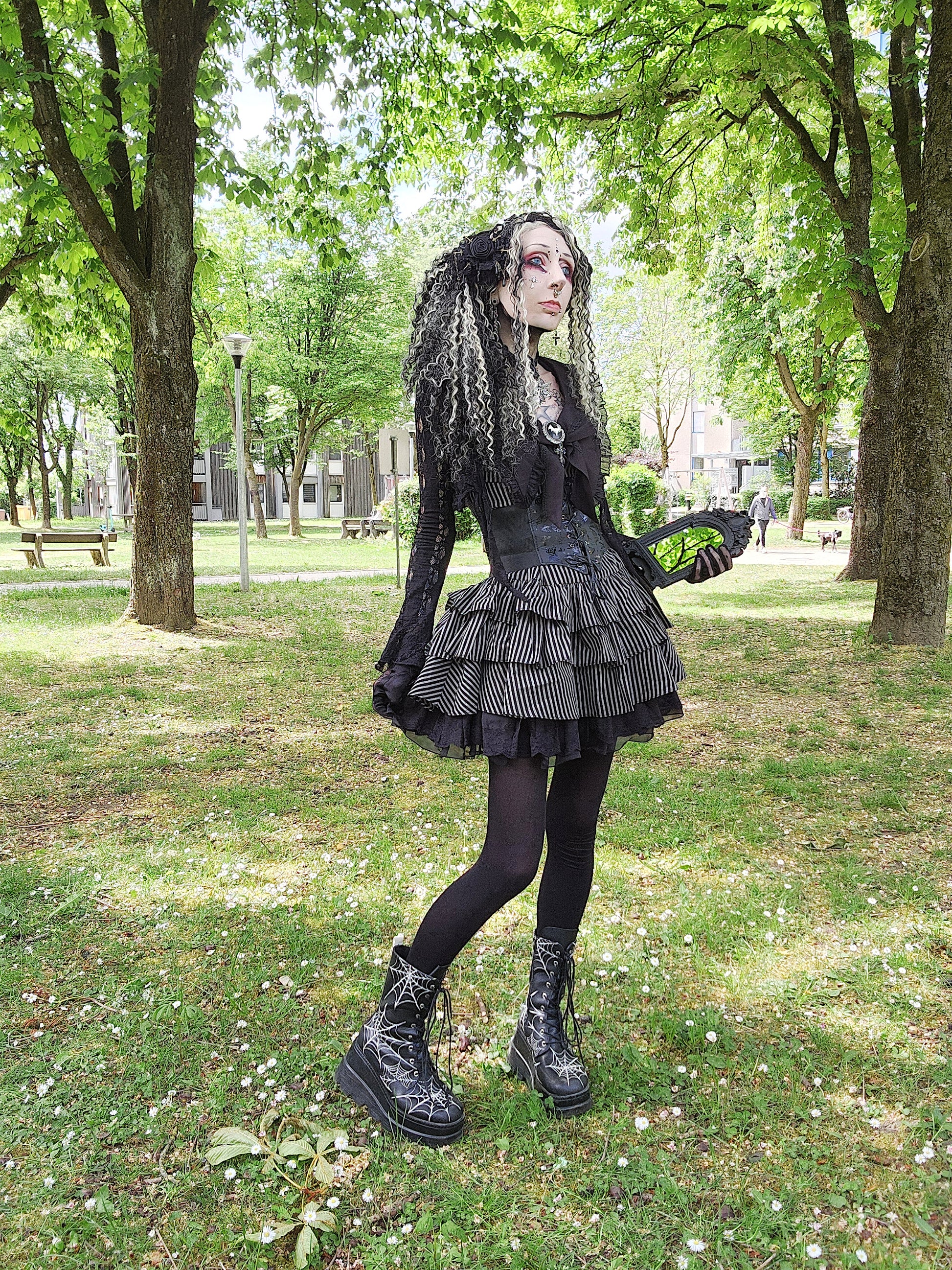 Valentinescorpse Dark in Love Vintage Striped Ruffle Tier Dress in a park setting