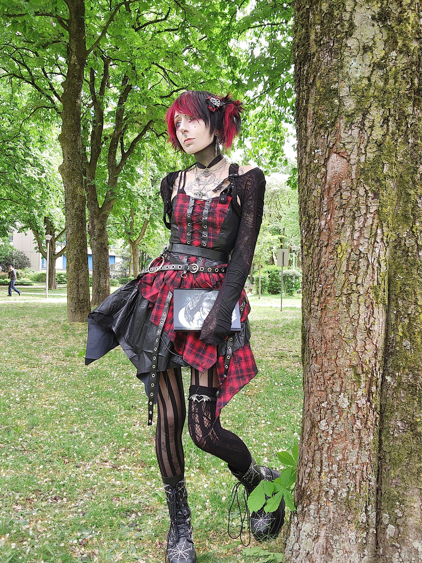 Valentinescorpse wearing Dark in Love Red Tartan Corset Punk Dress with Handkerchief Skirt in a park setting