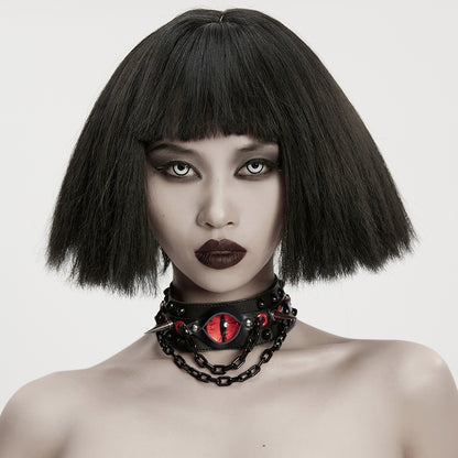 Red reptilian eye detail on gothic choker